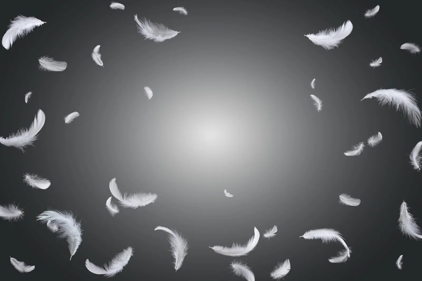 Pluma blanca flotando en la oscuridad representando guía angelical y conexión espiritual